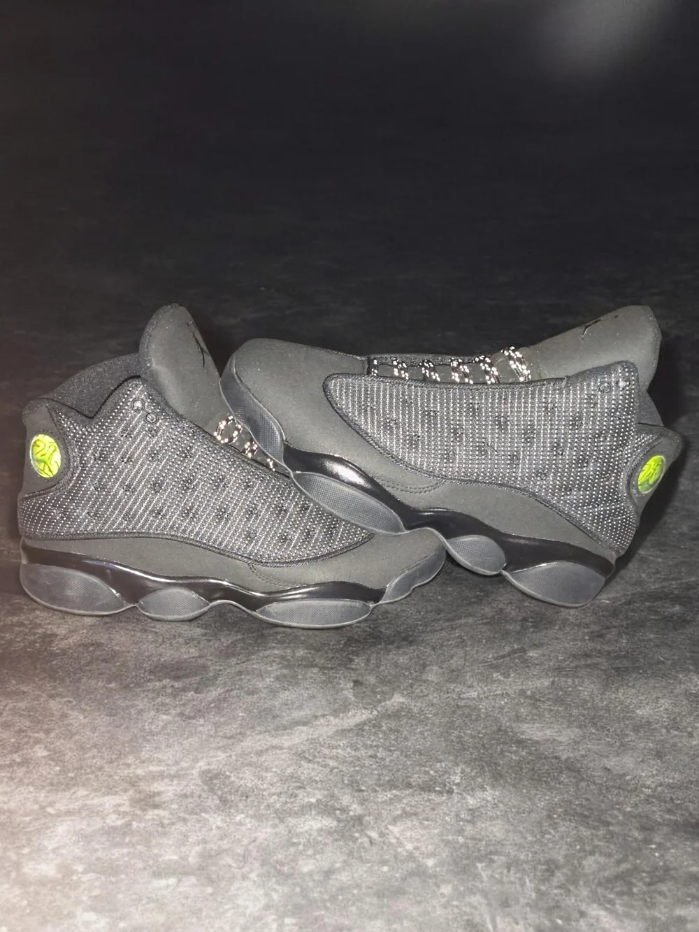 All-Black Jordan 13 Retro Basketball Sneakers with Lime Logo Accent